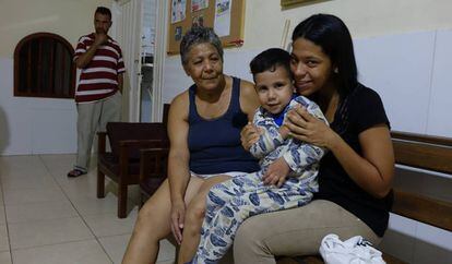 Venezuelan Susana Guevara, with one of her children, in Colombia.