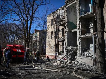 Ukrainian Emergency Service rescuers work on a building damaged by shelling in Kramatorsk, Donetsk region, Ukraine, on March 14, 2023.