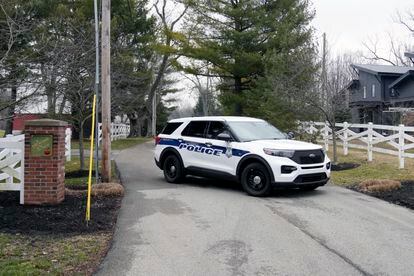 Police secure the entrance to the neighborhood of former Vice President Mike Pence's Indiana home, Friday, Feb. 10, 2023 in Carmel, Ind.