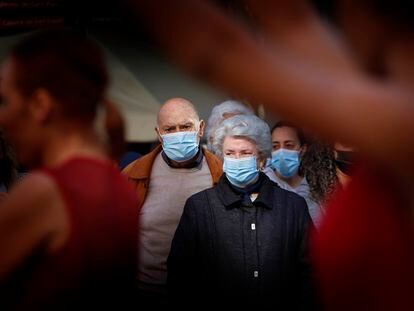 People wearing face masks in Terrassa, in Barcelona province, on Monday.
