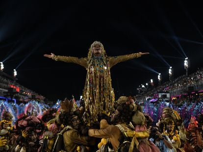 A carnival celebrant plays the part of Rosa María Egipciaca in Rio de Janeiro; February 21, 2023.