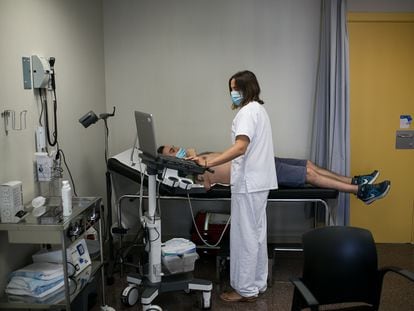 A doctor performs an ultrasound on a patient in Madrid, Spain.