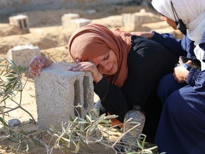 A Palestinian woman cries next to the grave of her son, killed after an Israeli bombing in Khan Younis, on January 18.