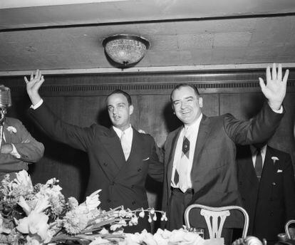 Cohn and McCarthy wave to the crowd.