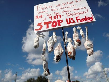 A sign with dolls attached to it is pictured during a rally calling for a cease fire in Gaza, in Tampa, Florida, U.S., October 21, 2023.