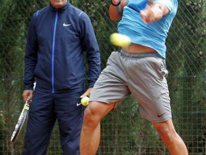 Nadal training with his coach and uncle, Toni.