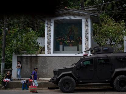 Vidalina Morales, a human rights defender, walks in front of an army vehicle in Cabañas, El Salvador, in August.