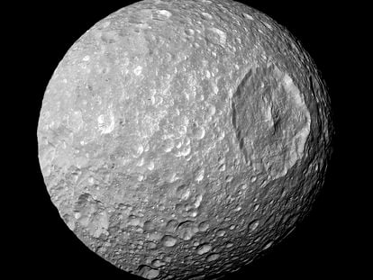 This image provided by NASA shows Saturn's moon Mimas and it's large Herschel Crater, captured by the Cassini spacecraft.  Feb. 13, 2010.