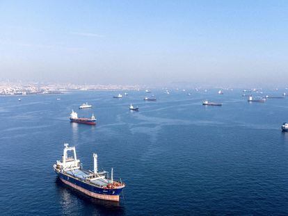 Commercial vessels including vessels which are part of Black Sea grain deal wait to pass the Bosphorus strait off the shores of Yenikapi during a misty morning in Istanbul, Turkey, in 2022.