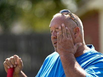Robert Harris pauses to wipe his face while digging fence post holes Tuesday, June 27, 2023, in Houston.