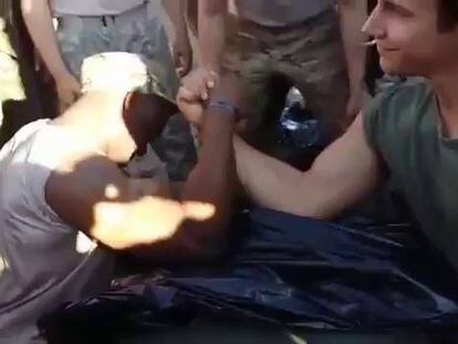 Video: A Spanish soldier beats a US Marine in an arm wrestle.