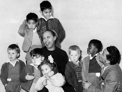 Joséphine Baker and her husband, Joe Bouillon, pose with seven of their 12 adopted children. Jean-Claude is the first from the left.