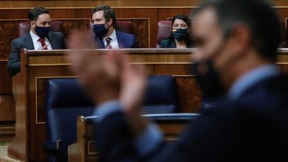 From left to right, Vox deputies Santiago Abascal, Iván Espinosa de los Monteros and Macarena Olona look on as Prime Minister Pedro Sánchez speaks in Congress on Wednesday.