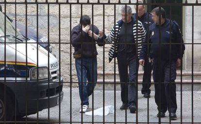 Ra&uacute;l Conejero hides his face as he arrives at court in Alicante earlier this year.