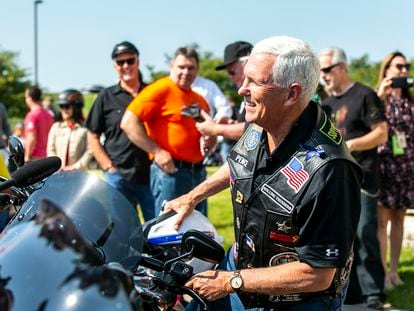 Former Vice President Mike Pence climbs onto his motorcycle on June 3, 2023, in Des Moines, Iowa.