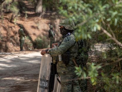 Special forces of the Mexican Army stand guard on a road in Aguililla.