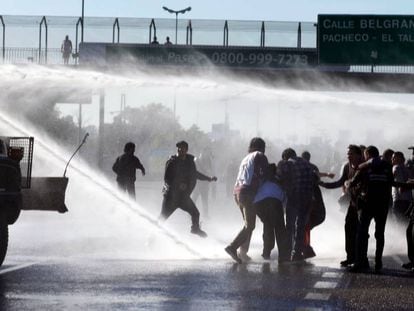Demonstrators clash with police in Buenos Aires on Thursday.