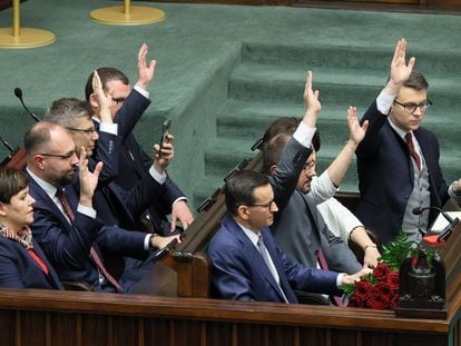 Members of the Polish Law and Justice government vote of confidence on Mateusz Morawiecki's (C) government at the Sejm, the lower house of parliament, in Warsaw, Poland, 11 December 2023.