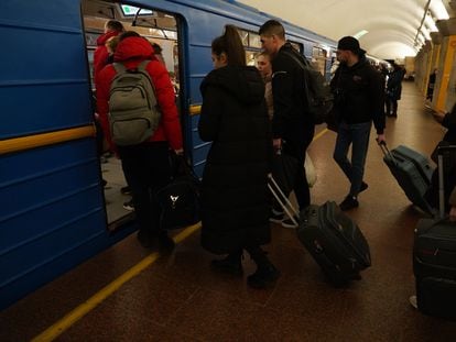 Dozens of passengers head to Kyiv’s subway system to get away from the violence.