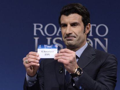 Former Barcelona and Real Madrid midfielder Luis Figo plucks the Catalan club out of the tombola at the Uefa draw ceremony on Monday. 