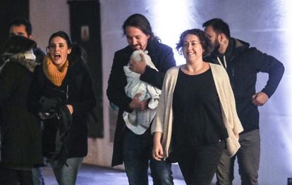 Unidas Podemos leader Pablo Iglesias and deputy Irene Montero (left) arrive at the event space Espacio Harley in Madrid to follow the election results. Iglesias is carrying his baby daughter in his arms.
