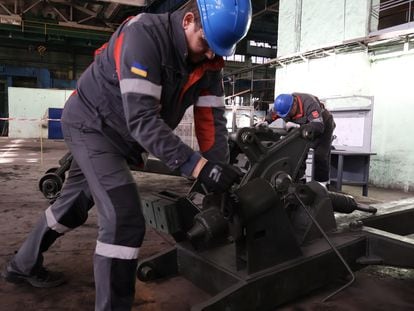 Metinvest employees prepare an anti-mine roller at a secret plant this December in central Ukraine.