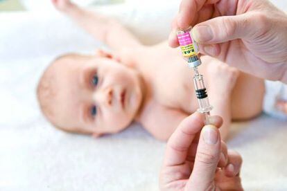 A baby gets its vaccines.