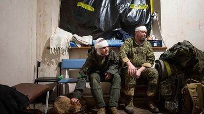 Ukrainian servicemen who were wounded at the battlefield wait to leave the field hospital near Bakhmut, Ukraine, Sunday, Feb. 26, 2023.