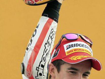 Marc M&aacute;rquez celebrates his title after finishing third at Cheste on Sunday.