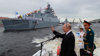 President Vladimir Putin with Defense Minister Sergei Shoigu and Navy chief Nikolai Yevmenov (in white) at the Navy Day celebration in St. Petersburg.