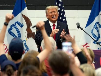 Former President Donald Trump reacts as he visits with campaign volunteers at the Grimes Community Complex Park, Thursday, June 1, 2023, in Des Moines, Iowa.