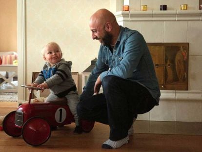 Pablo Capa plays with his 15-month-old son at his house in Kirkkonummi, Finland.