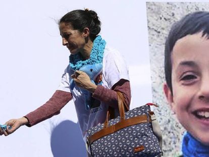 Patricia Ramírez passes by a photo of her son, victim Gabriel Cruz, at a protest for the return of the child.