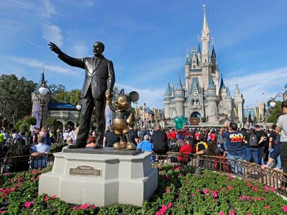 A statue of Walt Disney and Micky Mouse stands in front of the Cinderella Castle at the Magic Kingdom at Walt Disney World in Lake Buena Vista, Fla., Jan. 9, 2019.