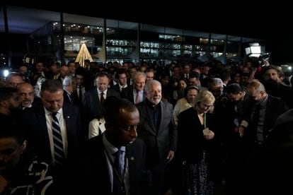 Brazil's President Luiz Inacio Lula da Silva, center, President of the Supreme Court Rosa Weber, center right, are accompanied by governors and ministers for an inspection visit a day after Congress was stormed by supporters of former president Jair Bolsonaro.