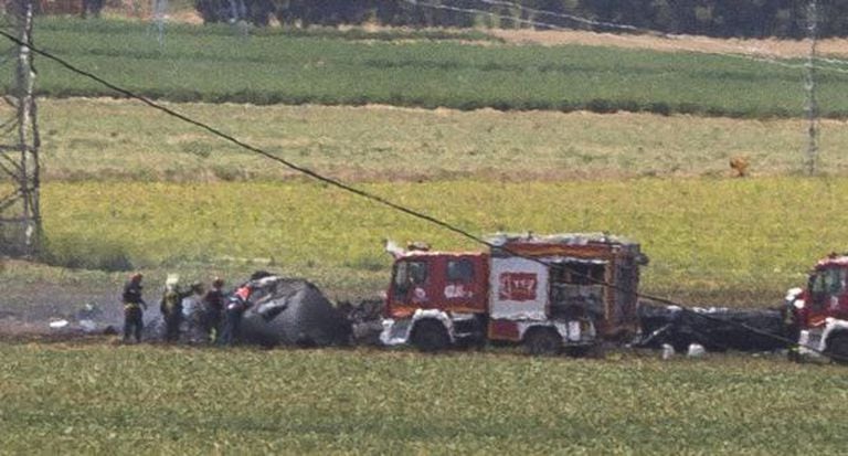 Firefighters at the scene of the Airbus A400M accident on May 9.