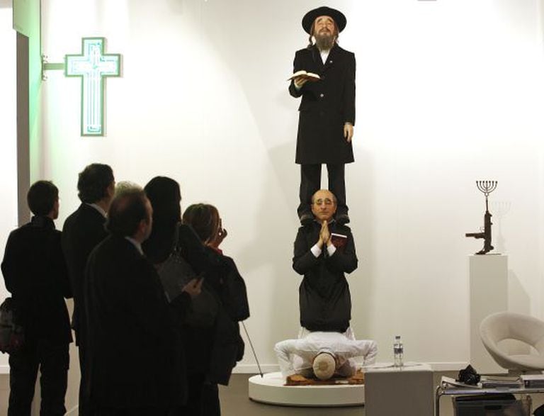 Artist Eugenio Merino’s work showing a Muslim, Christian and a Jew praying provoked protests in Israel in 2010.