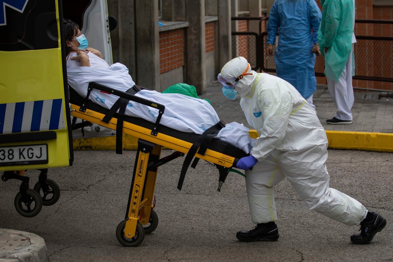 A patient is moved into an ambulance at the Severo Ochoa hospital in Leganes.