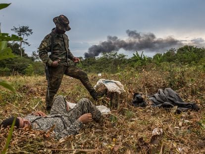 Soldiers rest after destroying a drug laboratory in the Colombian jungle.