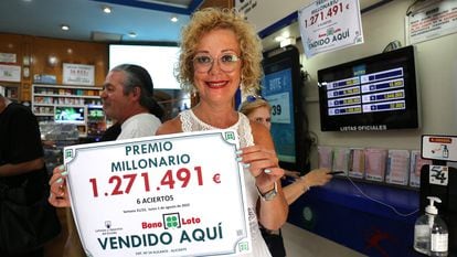 Mari Ángeles Torregrosa, the owner of the shop who sold the winning ticket.