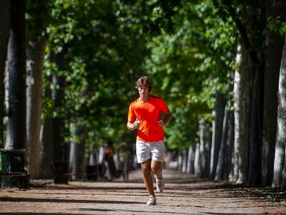 A man runs in the Retiro Park in Madrid, Spain.