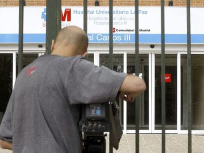 A news camera films outside the Carlos III hospital in Madrid.