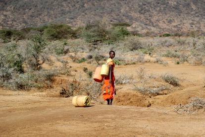 A Samburu woman fetches water during a drought in Loolkuniyani Primary School, Samburu County, Kenya, Oct. 16, 2022