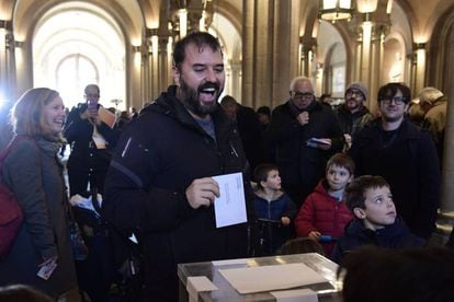 A man casts his ballot for the Catalan regional election at a polling station in Barcelona.