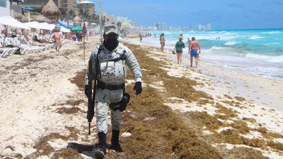 A member of the National Guard on patrol in Playa Ballena, in the Mexican resort of Cancún, on April 4.