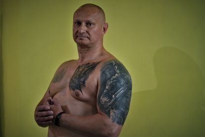Roman Marchenko, 53, served in the Soviet Army between 1988 and 1990. A tattoo on his left shoulder celebrating a Soviet elite corps that got at the time has recently been covered up with one of a member of the Ukrainian Special Forces.