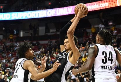 San Antonio Spurs' Victor Wembanyama (C) controls the ball during the NBA Summer League game between the San Antonio Spurs and Portland Trail Blazers, at the Thomas and Mack Center in Las Vegas, Nevada, on July 9, 2023.