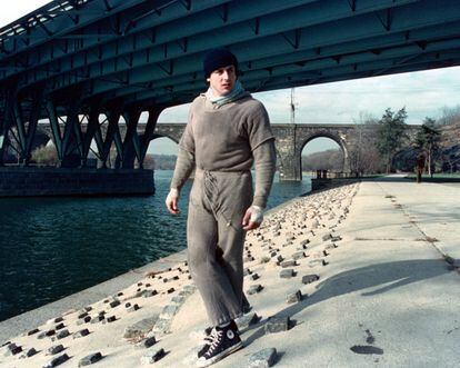 Sylvester Stallone as Rocky Balboa jogging through Philadelphia.