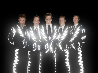 The band The Hives, with Howlin’ Pelle Almqvist in the center.