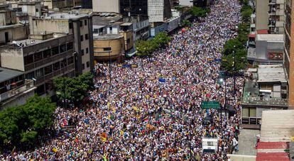 Thousands of people march on the streets of Caracas.